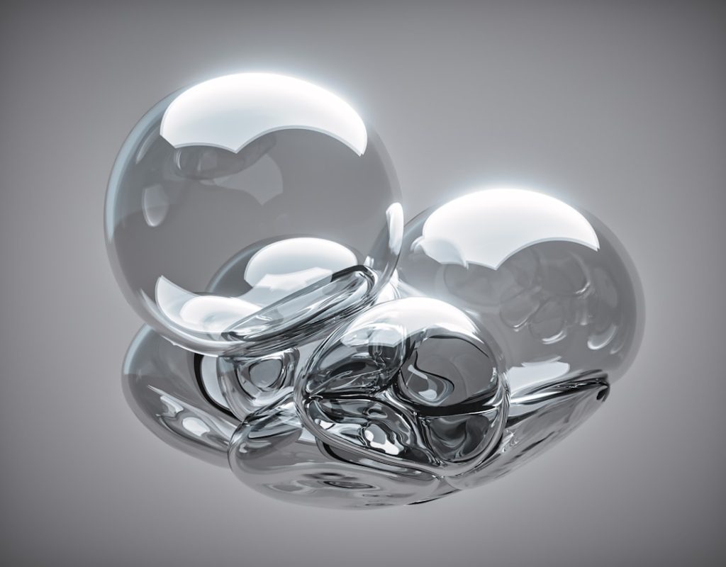 a-group-of-shiny-balls-sitting-on-top-of-a-table-oqjz479v5no